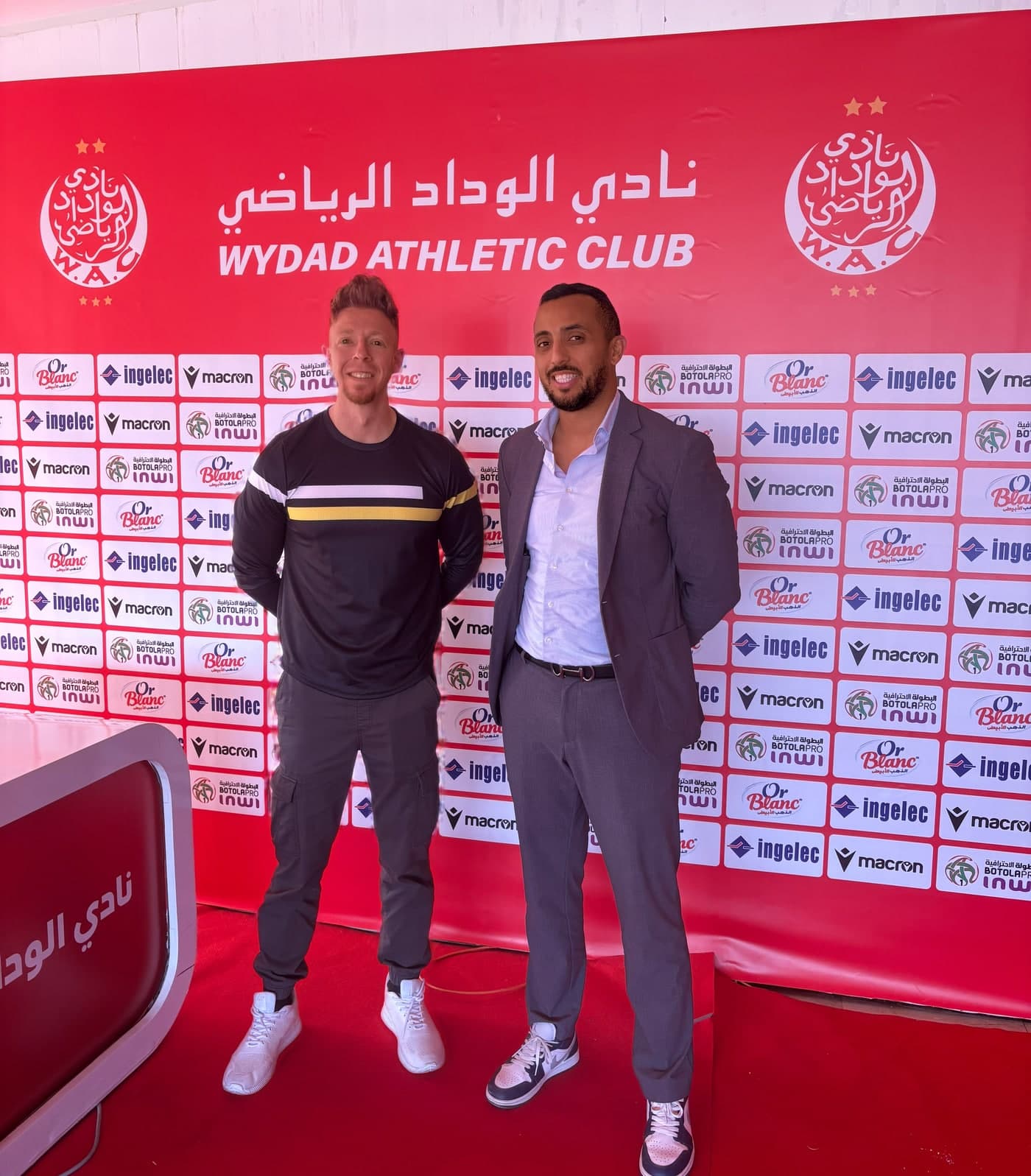 Mike Dietze with Wydad Athletic Club's sporting director during the 2025 U-17 Africa Cup of Nations in Morocco